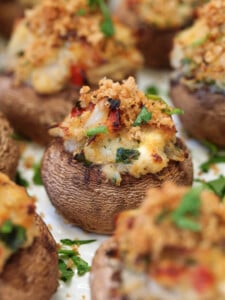 crab stuffed mushroom on white platter