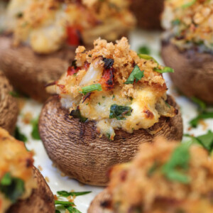 crab stuffed mushroom on white platter