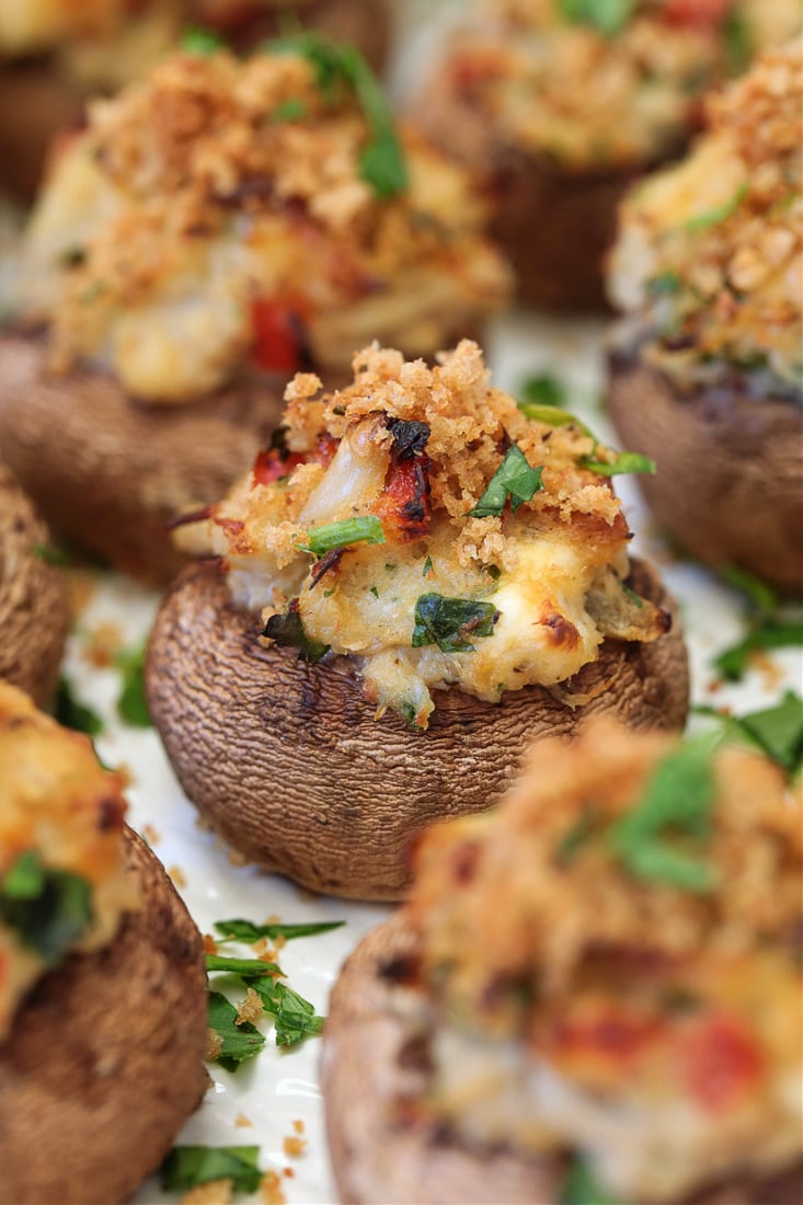 crab stuffed mushroom on white platter