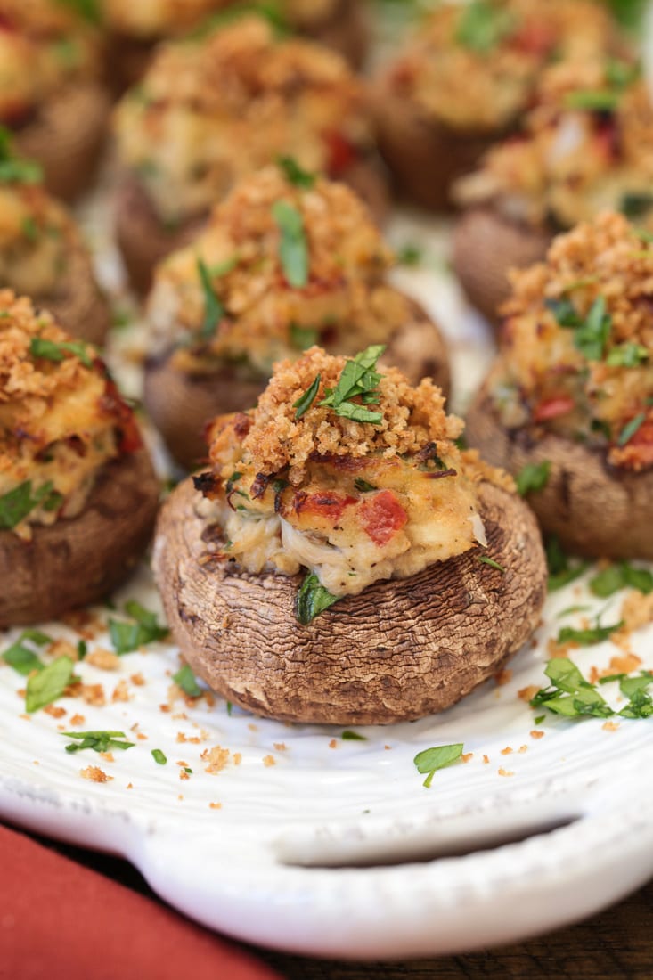 crab stuffed mushroom on white platter