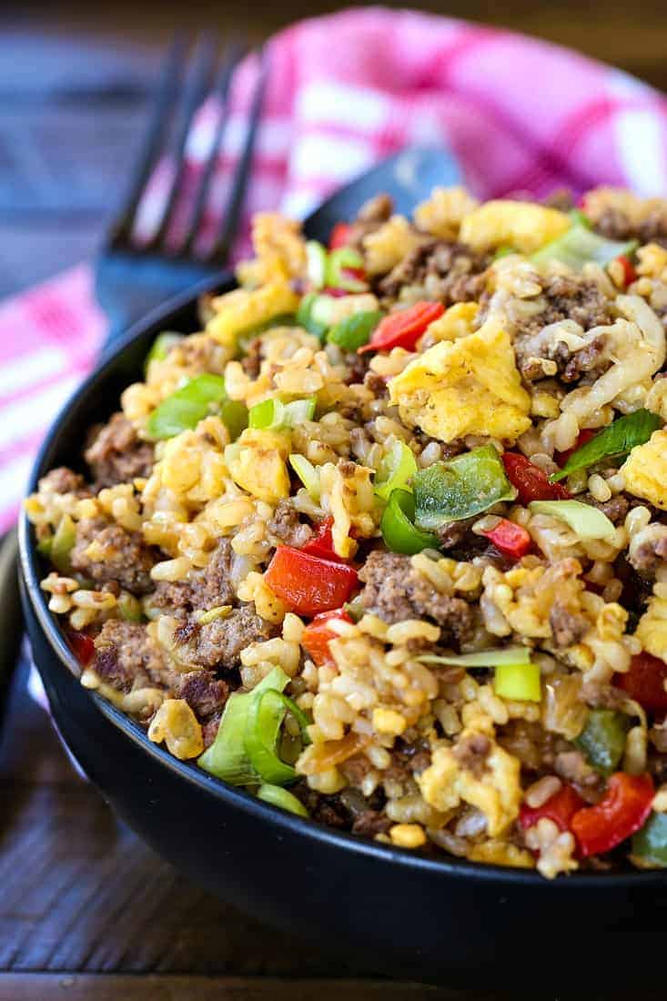 Philly Cheesesteak Fried Rice is the ultimate, comfort food dinner! Ground beef, peppers and gooey cheese make this fried rice irresistible! Philly Cheesesteak Fried Rice is a fried rice recipe with beef and cheese that's perfect for dinner
