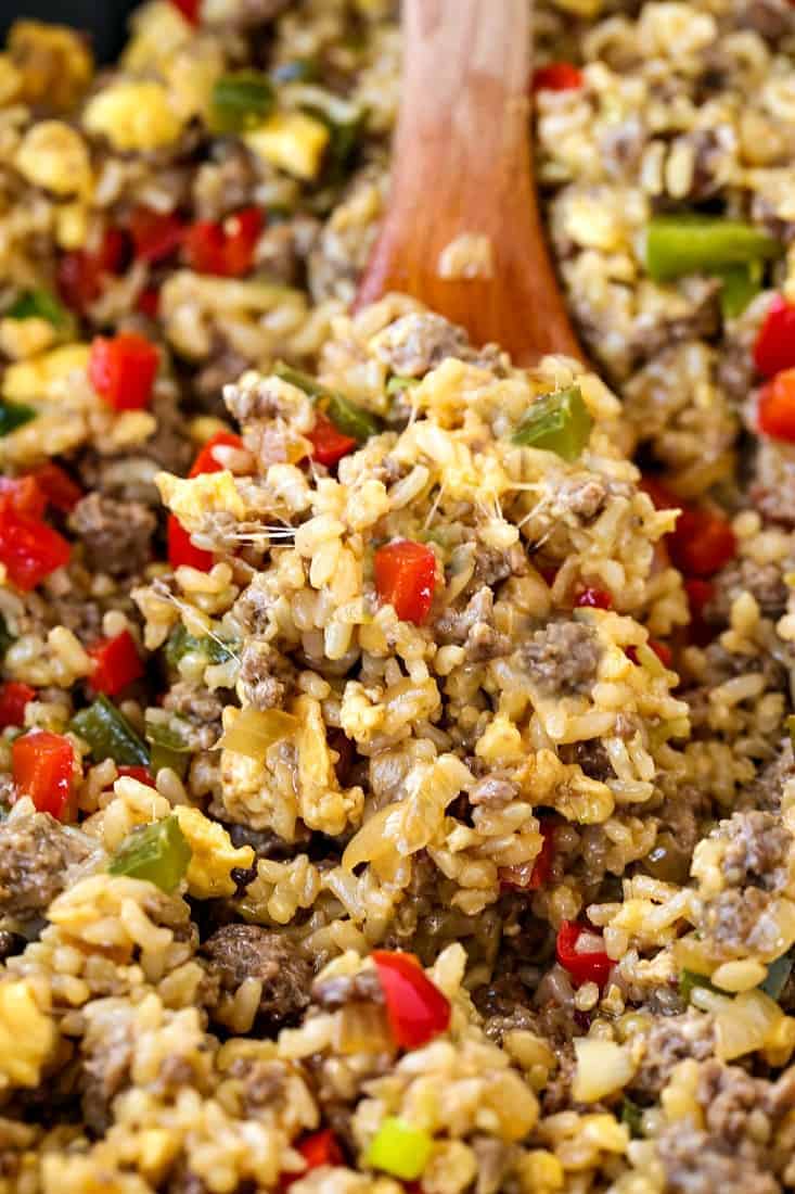 Philly Cheesesteak Fried Rice is the ultimate, comfort food dinner! Ground beef, peppers and gooey cheese make this fried rice irresistible! Philly Cheesesteak Fried Rice is a fried rice recipe that has the flavors of a philly cheesesteak