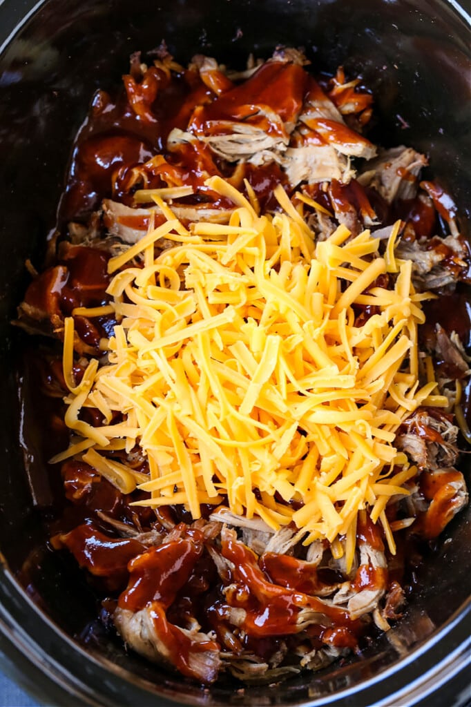 shredded cheese on top of pulled pork