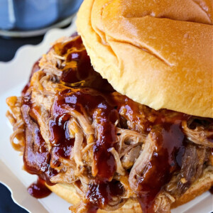 bbq pulled pork sandwich with sauce dripping down