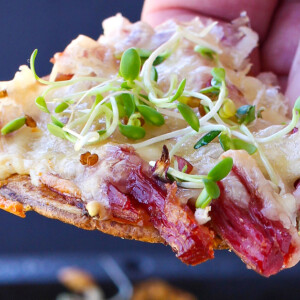 Irish nachos topped with corned beef, sprouts and cheese