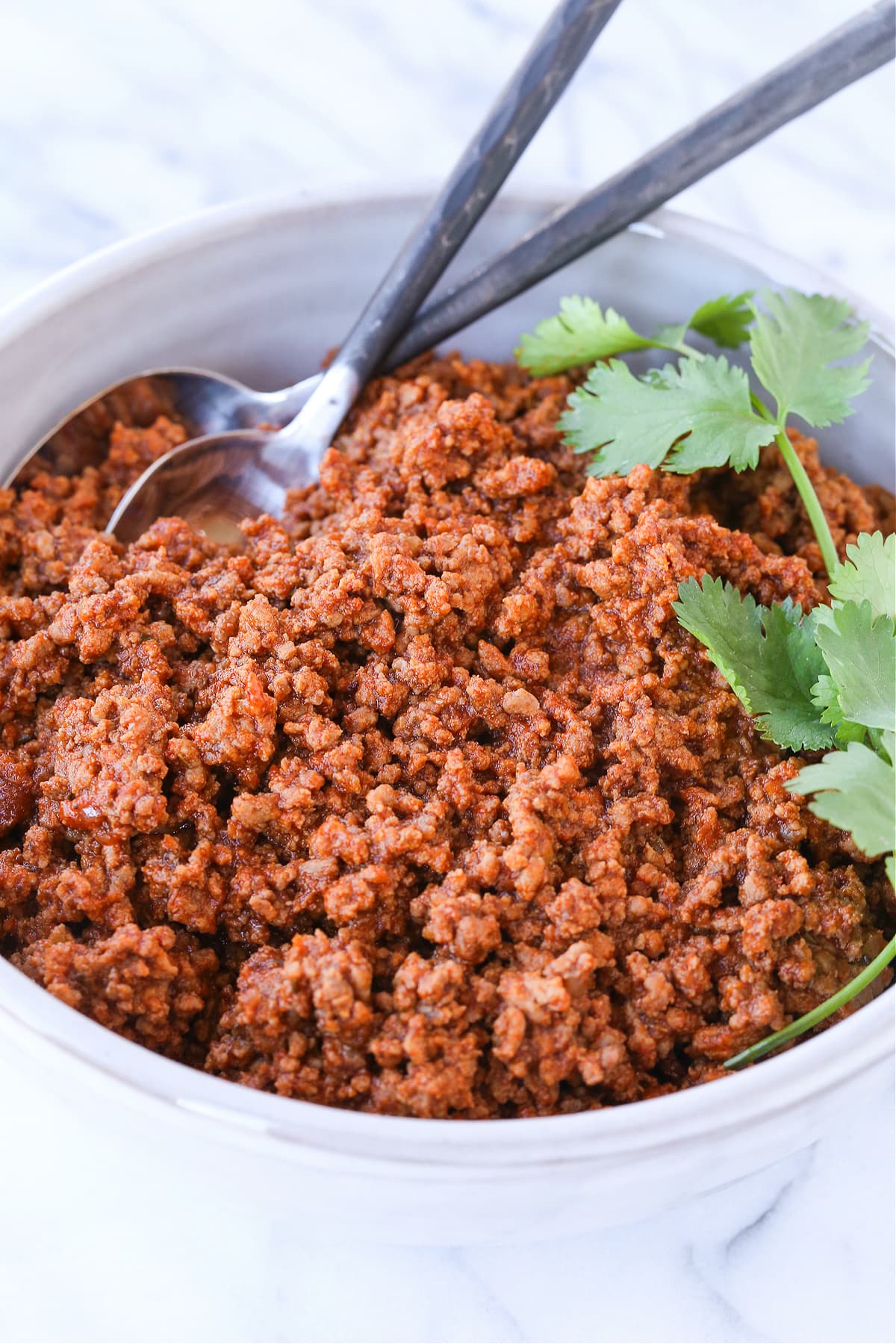 ground beef taco meat in bowl with cilantro