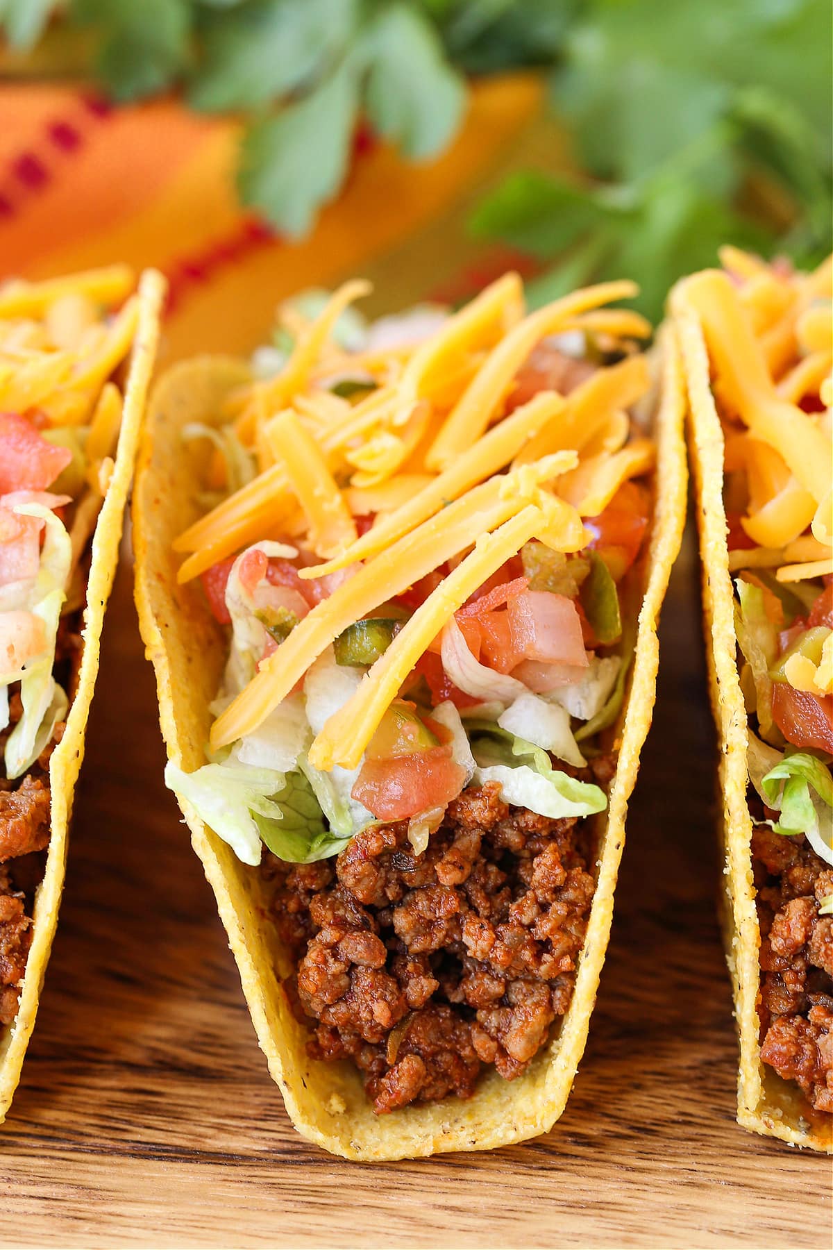 ground beef tacos with toppings on board