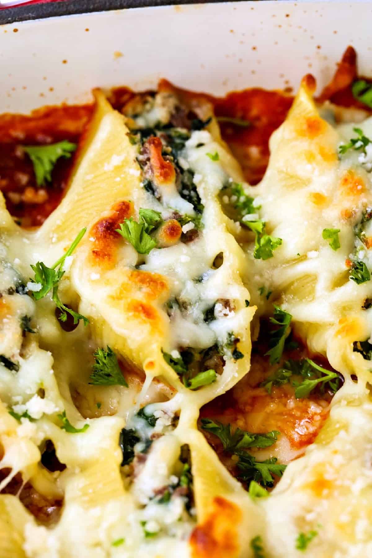 stuffed shells with beef and spinach in baking dish