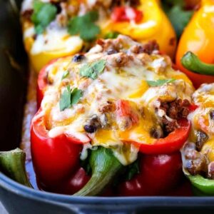 Cheesy Mexican Stuffed Peppers are topped with cheese and filled with beef and beans