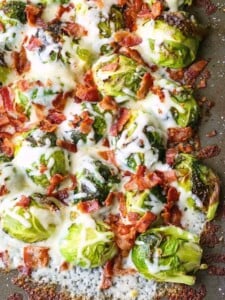 Loaded Sheet Pan Brussels Sprouts are a roasted brussels sprouts recipe topped with cheese and bacon