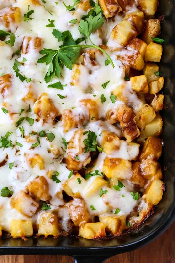 Disco Fries Casserole is a layered potato casserole topped with gravy and mozzarella cheese