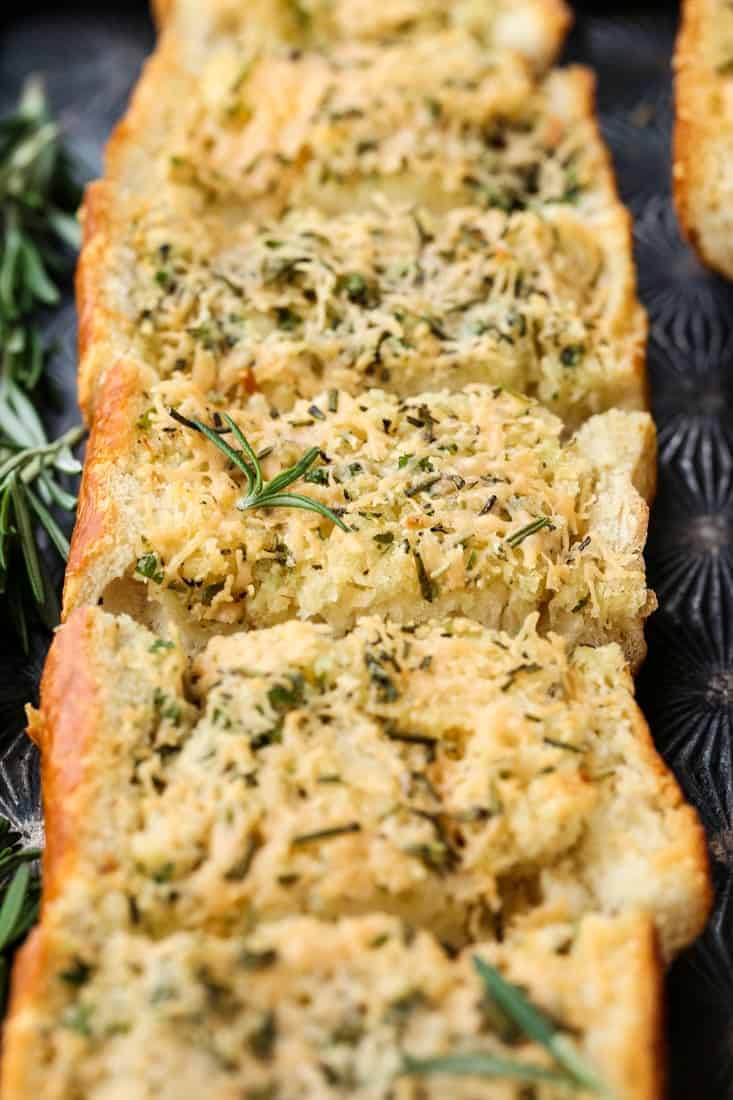 Rosemary Asiago Garlic Bread is herby and buttery with a crisp crust. Serve this garlic bread with everything from pasta to steak! Rosemary Asiago Garlic Bread is a side dish recipe that goes with many dinners