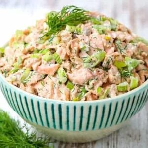 Salmon Salad recipe in a bowl with spoons and fresh dill