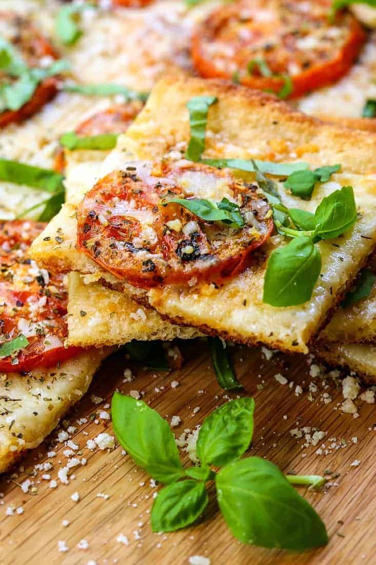 Roasted Tomato Basil Pizza is a pizza recipe with roasted tomatoes and fresh basil