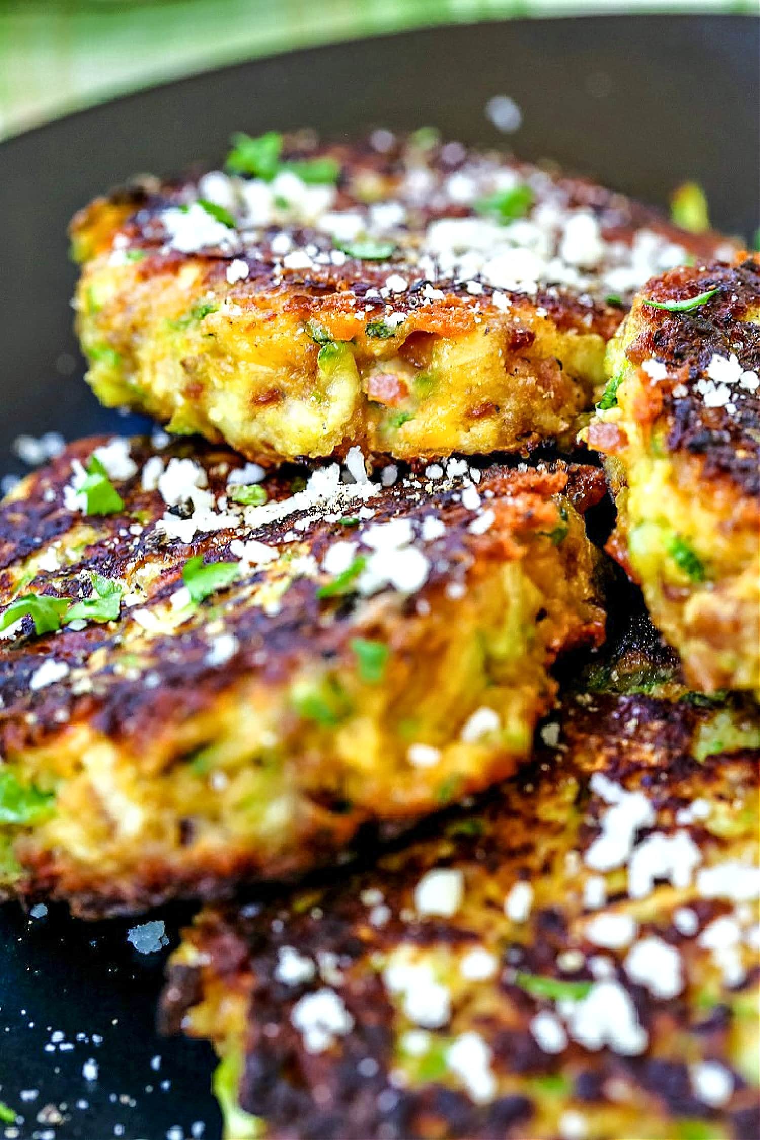 zucchini cakes with bacon and cheese on plate