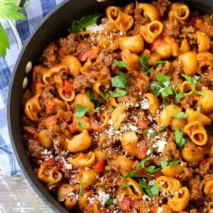 obe pot beef goulash in a skillet from the top with a napkin