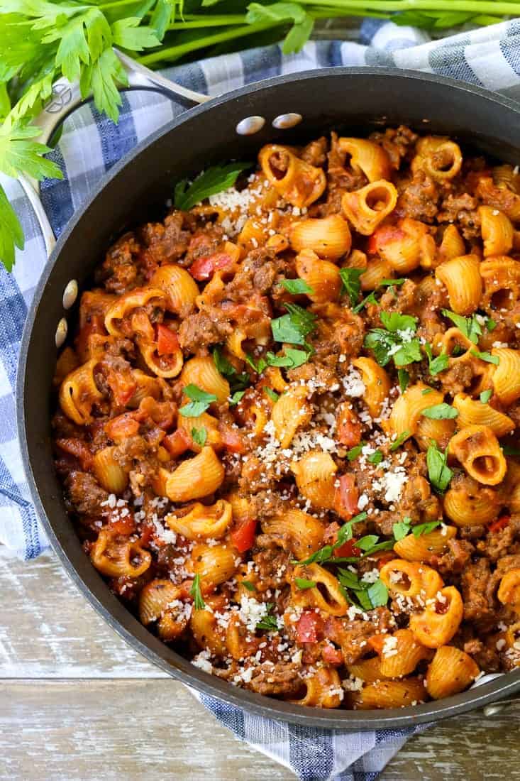 obe pot beef goulash in a skillet from the top with a napkin