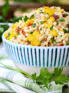 creamed corn in a bowl with parsley