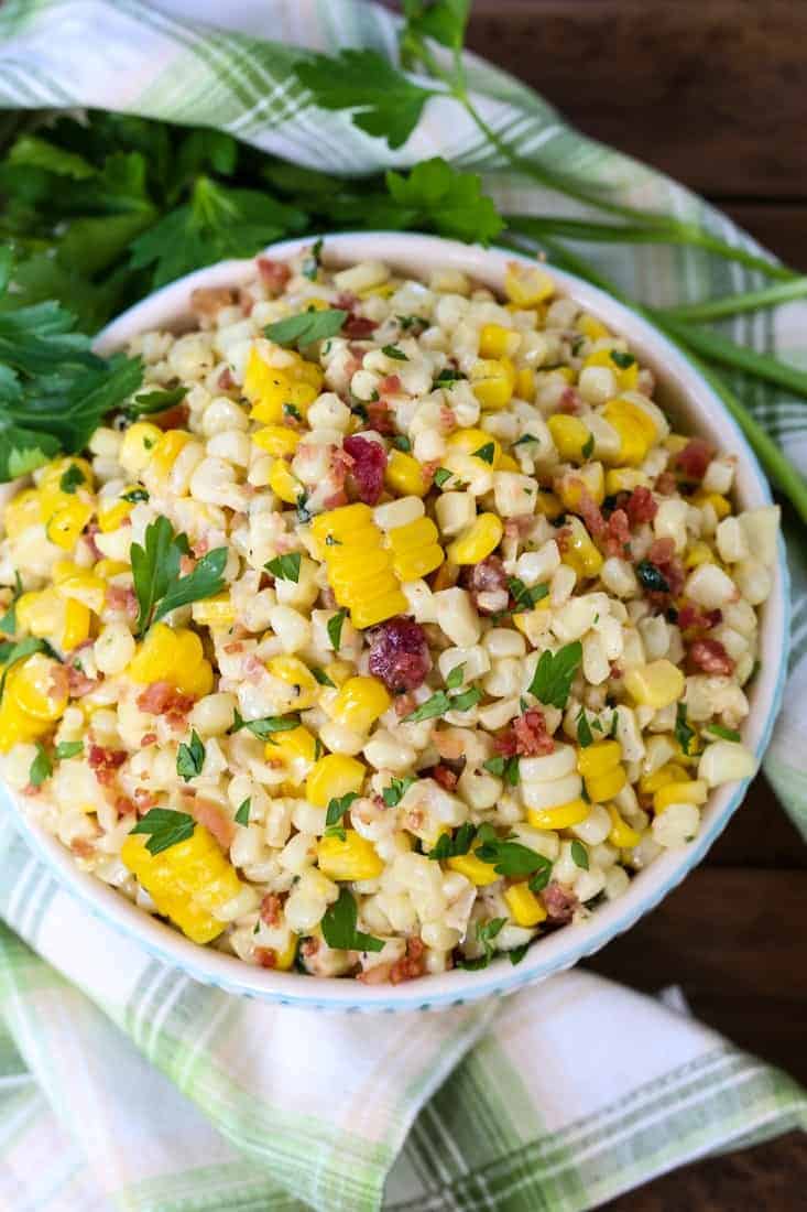 creamed corn with bacon in a bowl from the top