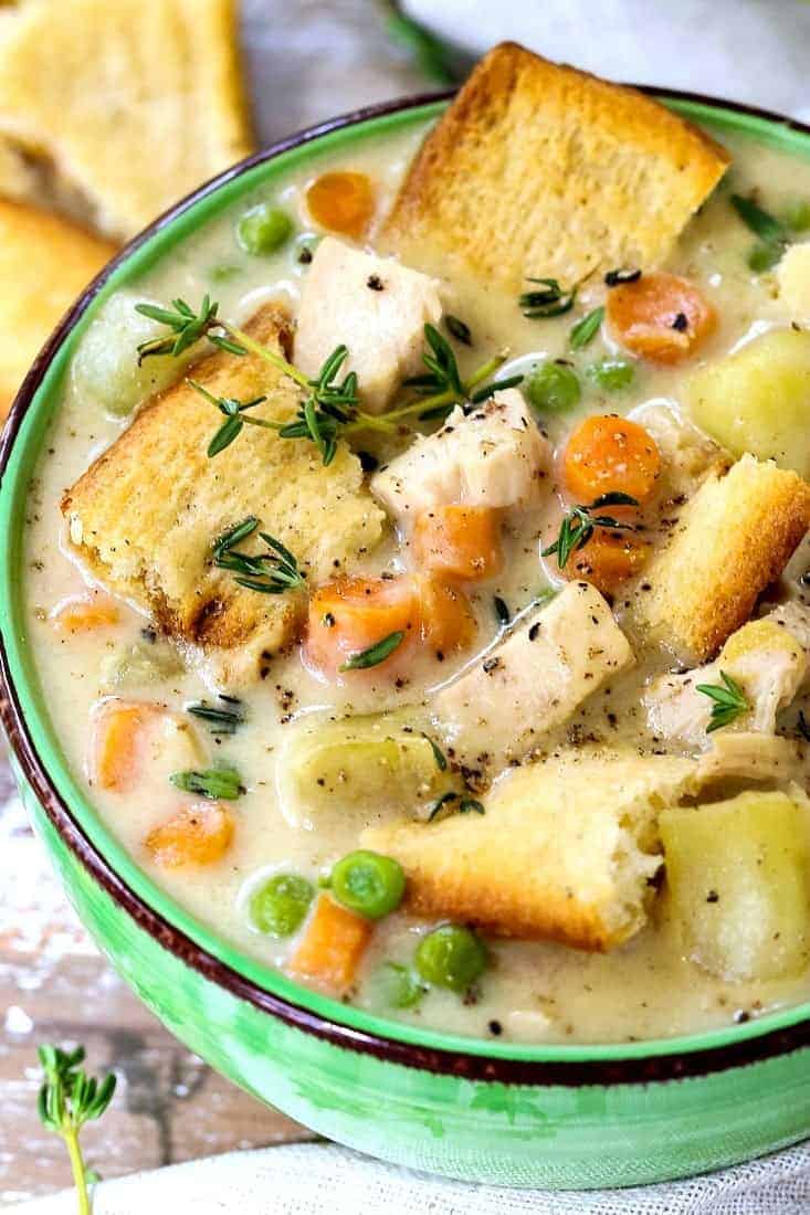 chicken soup in a bowl with pie crust pieces on top