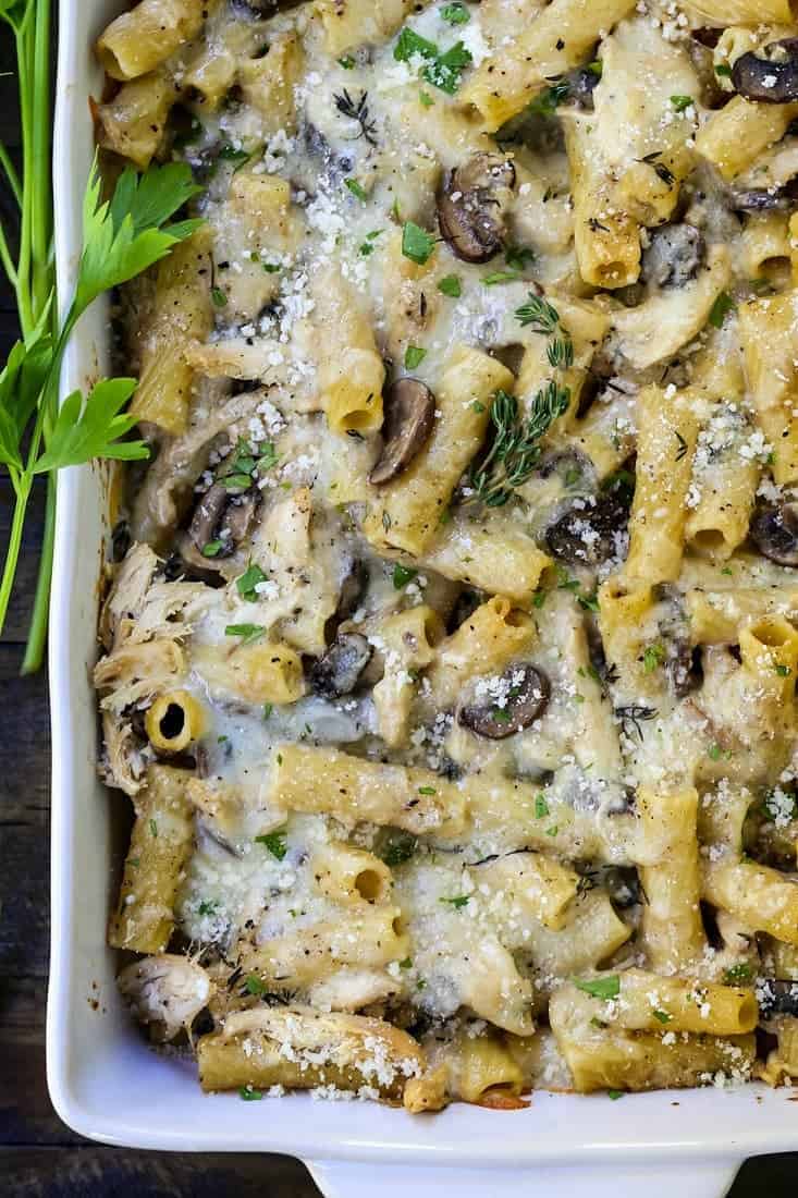 chicken marsala baked ziti in a casserole on a wooden table