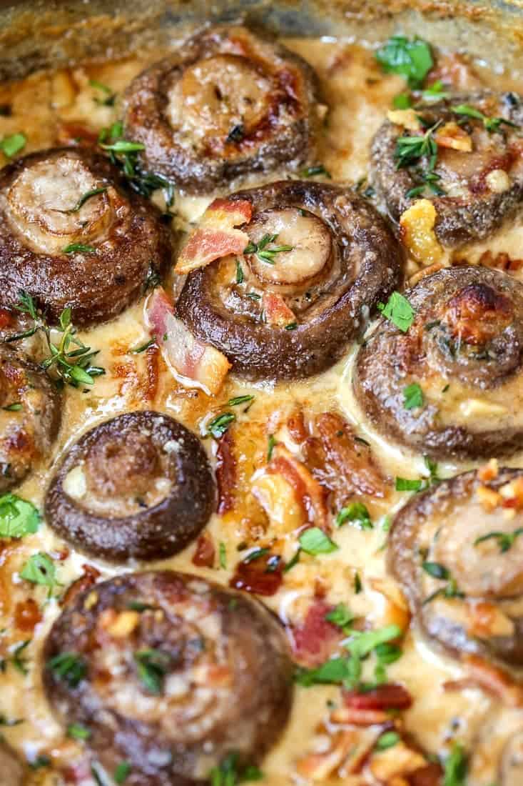 Our Creamy Bacon Mushrooms are cooked in the most addicting cream sauce! Spoon over steak or chicken, even makes an amazing pasta sauce! mushrooms with bacon in a parmesan cream sauce