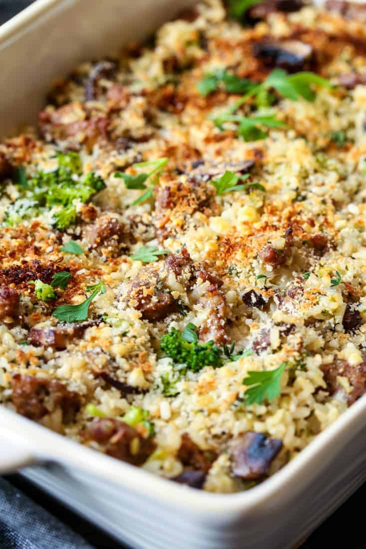 sausage and broccoli casseerole in a baking dish with parsely