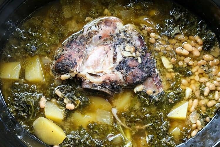 pork stew in a slow cooker with potatoes and beans