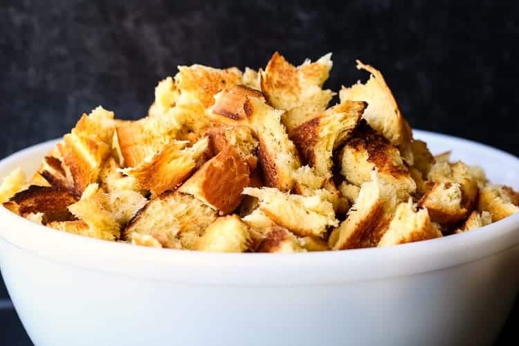 toasted bread cubes in a white bowl