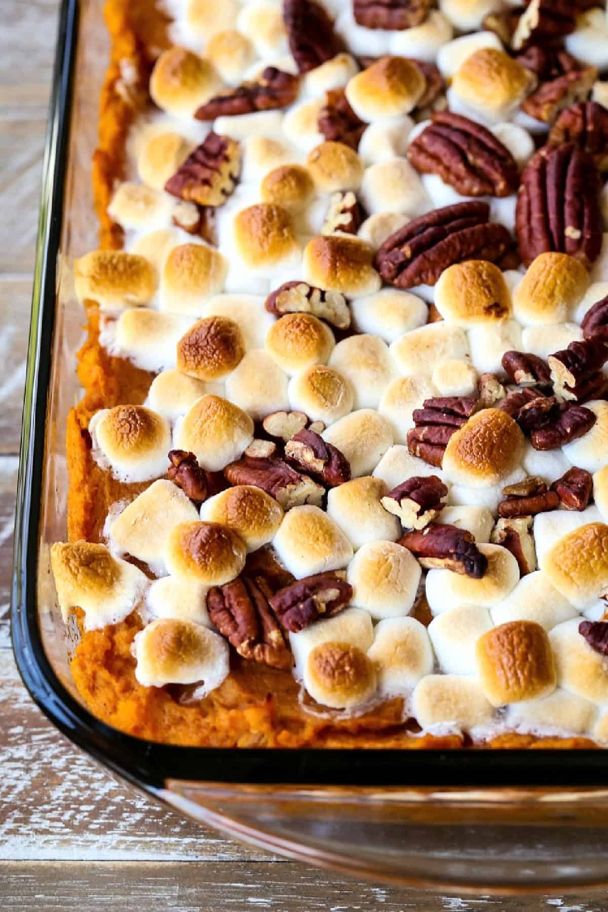 close up of sweet potato casserole in glass dish
