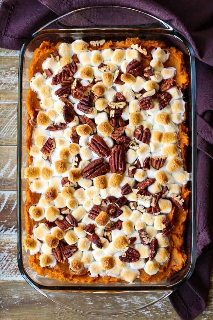 bourbon sweet potato casserole with a brown napkin on the side