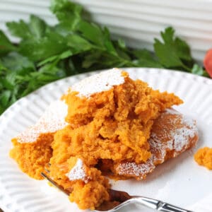 scoop of carrot souffle on plate with fork