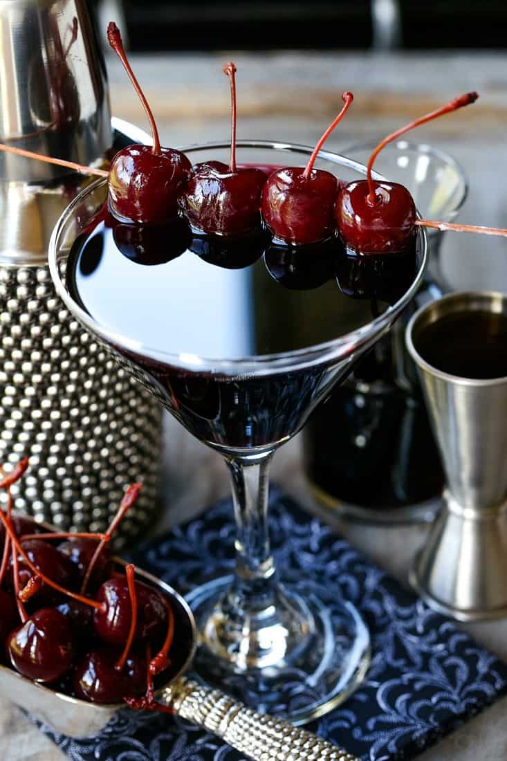 manhattan cocktail in a martini glass with cherries