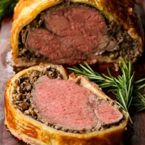 Beef tenderloin wrapped in puff pastry with creamy minced mushrooms.