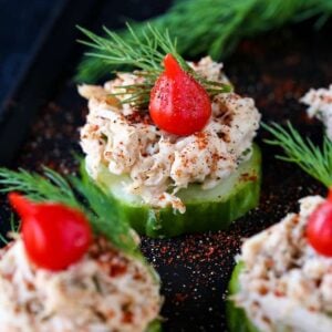 crab salad on top on cucumber slices with a red bell pepper