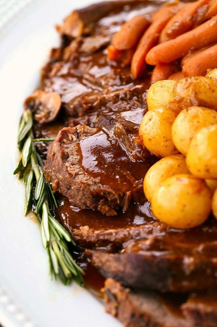 pot roast recipe sliced with gravy and vegetables
