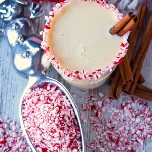 peppemint eggnog cocktail with cinnamon sticks