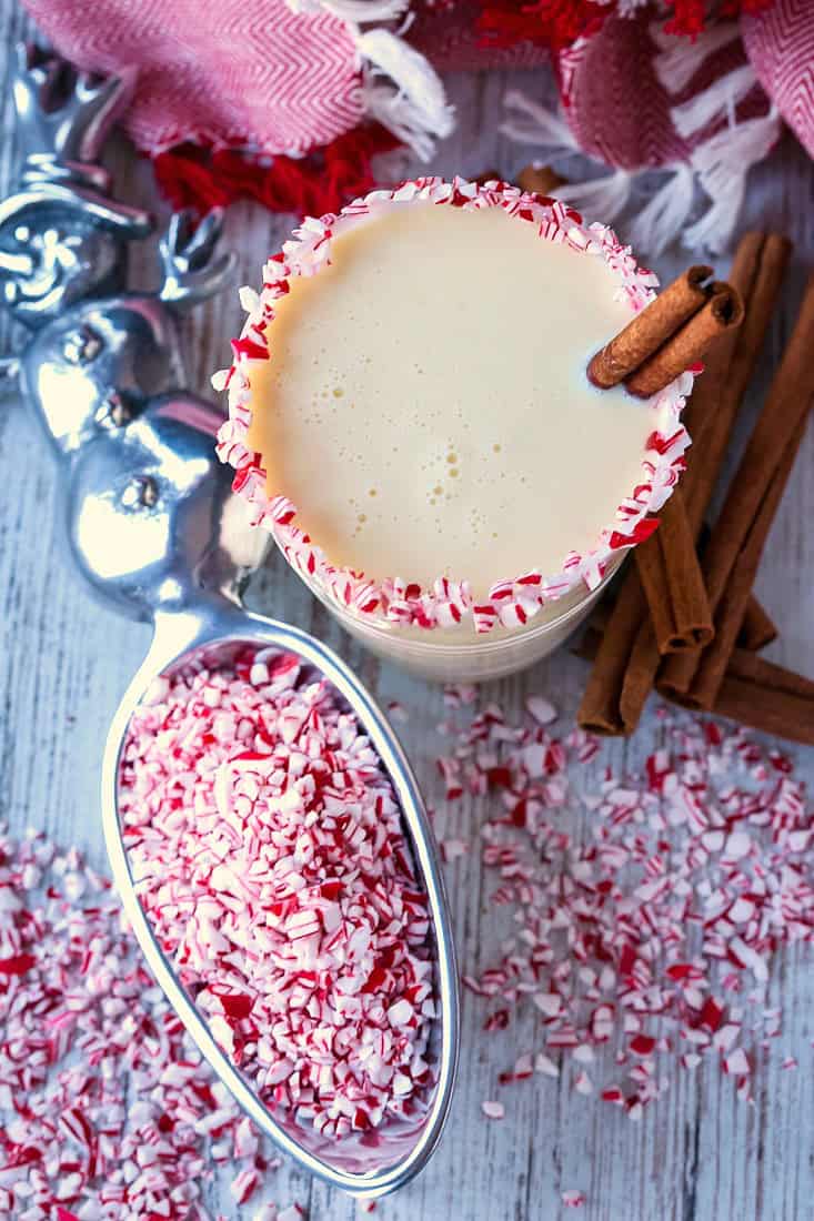 peppemint eggnog cocktail with cinnamon sticks