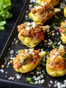 stuffed artichoke hearts with sausage, cheese and a bread crumb topping