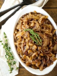 slow cooker caramelized onions in a white dish