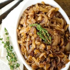 slow cooker caramelized onions in a white dish