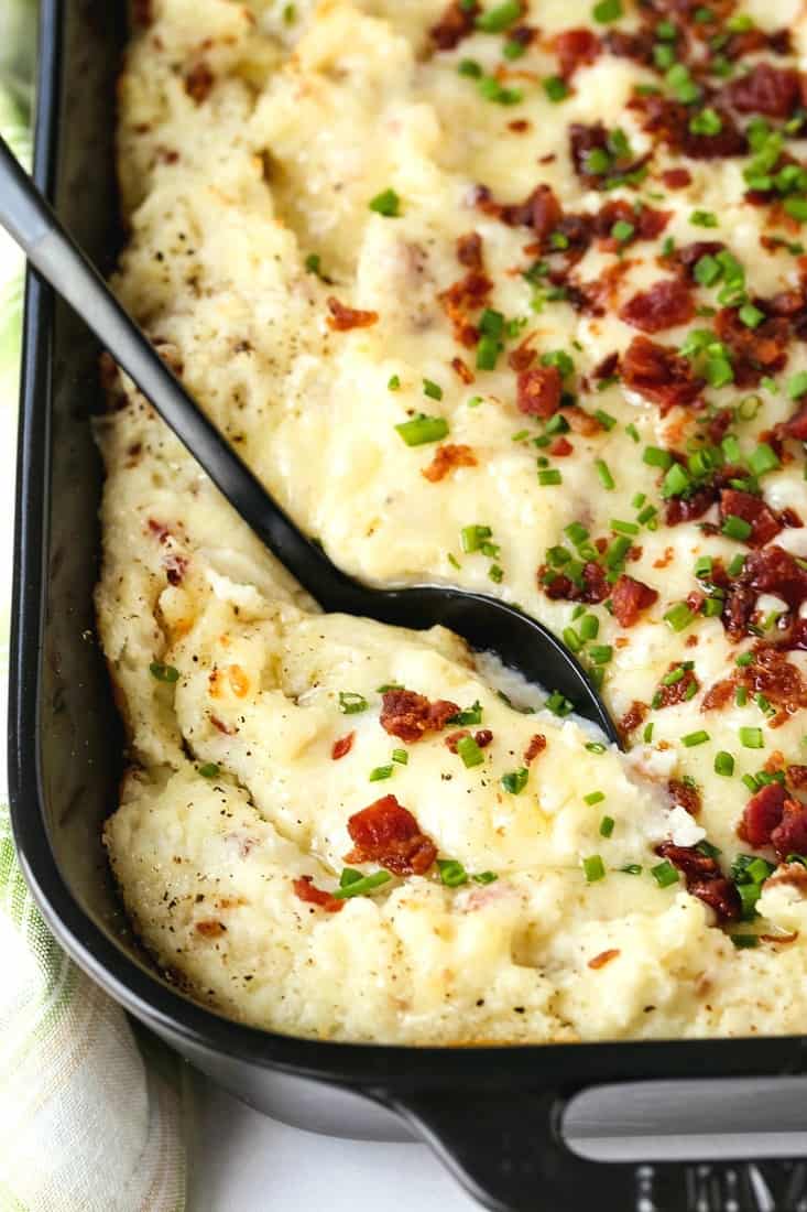 twice baked potato casserole recipe with a black spoon