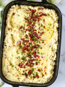 twice baked potato casserole topped with bacon and chives