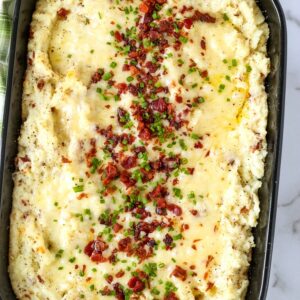 twice baked potato casserole topped with bacon and chives