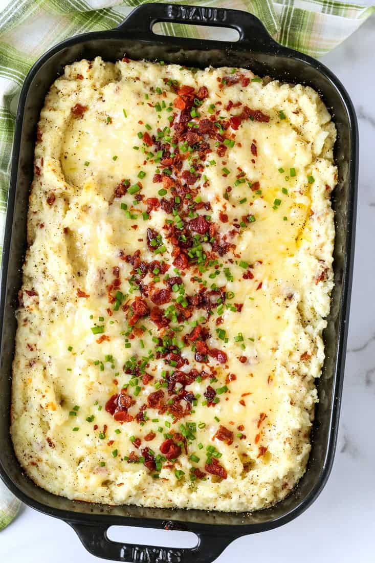 twice baked potato casserole topped with bacon and chives