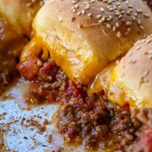 Beef casserole recipe topped with buns and cheese