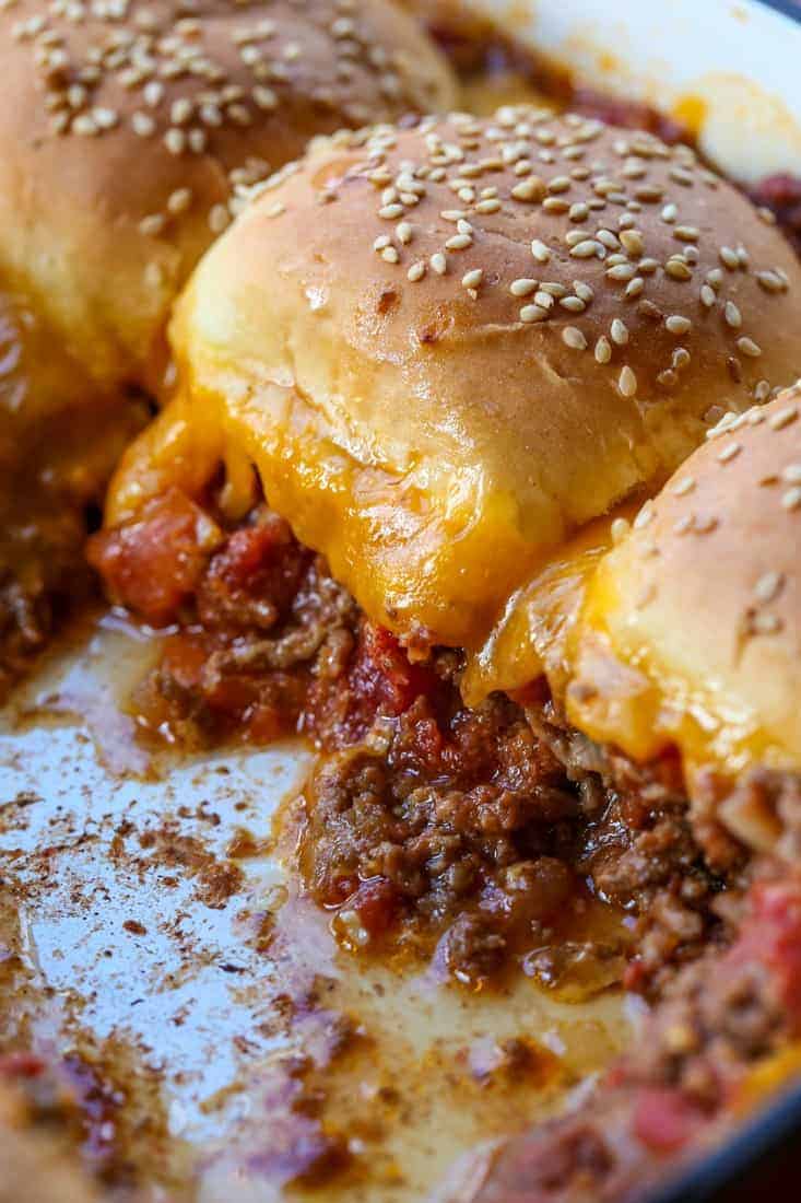 Beef casserole recipe topped with buns and cheese