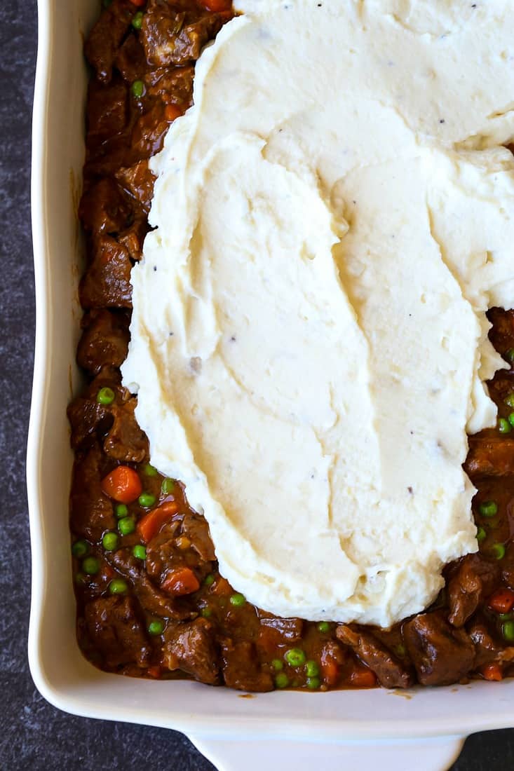 Beef Shepherd's Pie recipe getting topped with mashed potatoes