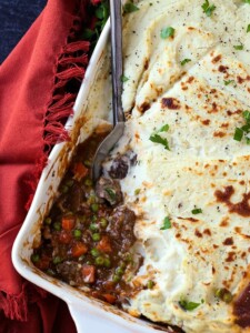 Guinness Beef Shepherd's Pie with a spoon in the casserole dish