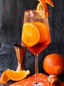 aperol spritz on napkin with orange slices